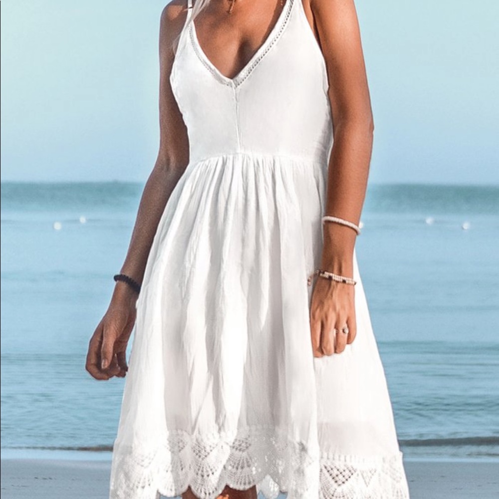 white maxi dress, with lace at the bottom.